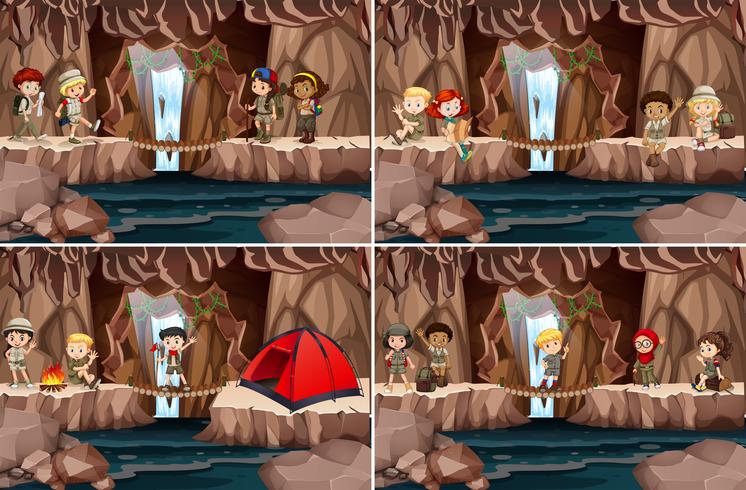 Conjunto de crianças acampadas na caverna vetor