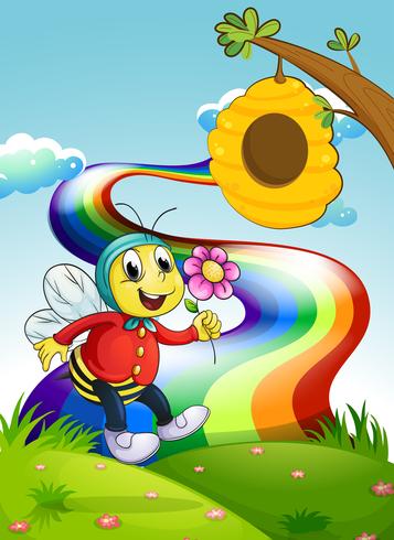 Uma abelha sorridente segurando uma flor no topo da colina com um arco-íris vetor