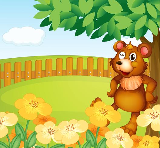 Um urso em pé perto das flores vetor