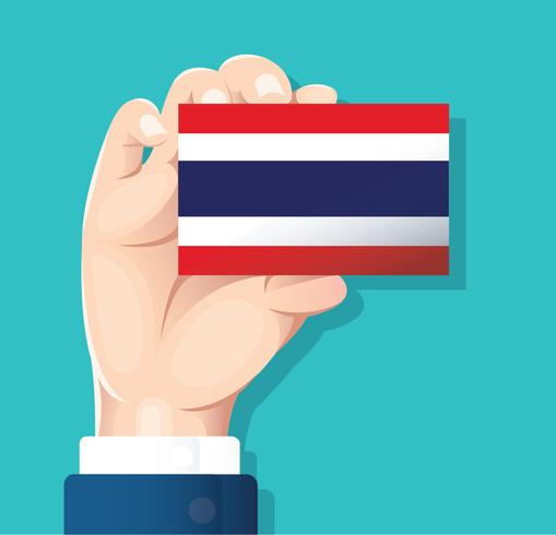 mão segurando o cartão de bandeira de Tailândia com fundo azul vetor