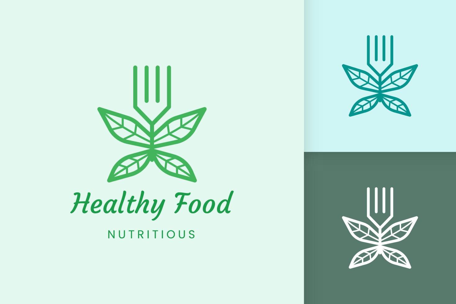 logotipo de comida saudável com forma de garfo e folha vetor