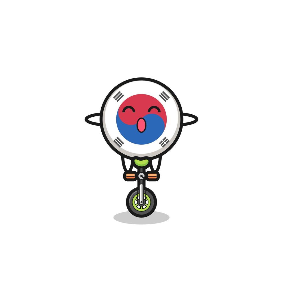 o personagem bonito da bandeira da coreia do sul está andando de bicicleta de circo vetor