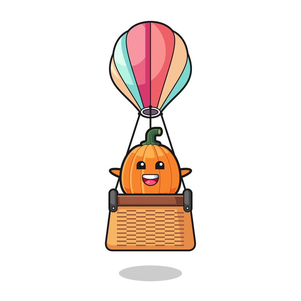 mascote de abóbora montando um balão de ar quente vetor