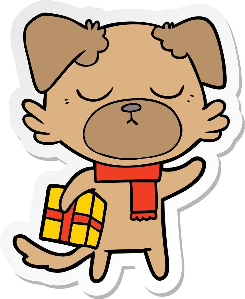 adesivo de um cachorro bonito dos desenhos animados com presente de natal vetor