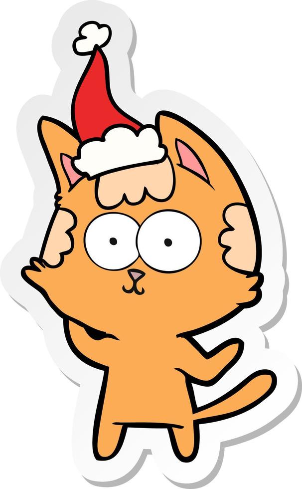 desenho de adesivo feliz de um gato usando chapéu de papai noel vetor