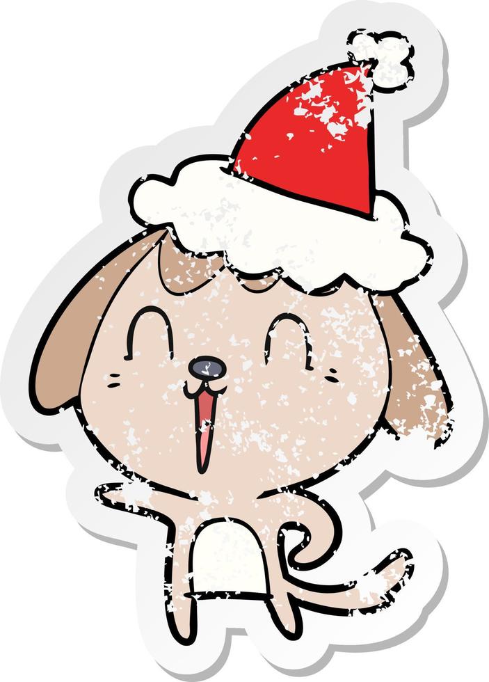 bonito desenho de adesivo angustiado de um cachorro usando chapéu de papai noel vetor