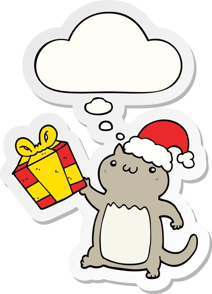 gato de natal bonito dos desenhos animados e balão de pensamento como um adesivo impresso vetor