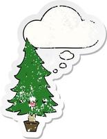 árvore de natal de desenho animado bonito e balão de pensamento como um adesivo desgastado vetor