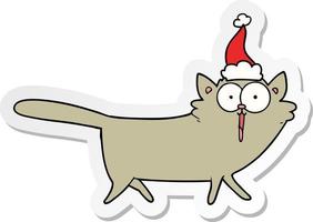 desenho de adesivo de um gato usando chapéu de papai noel vetor