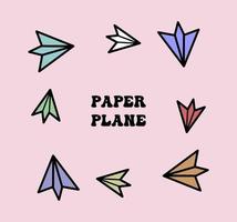 conjunto de cores de avião de papel no fundo rosa vetor