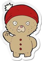 adesivo de um desenho animado acenando ursinho com chapéu de inverno vetor