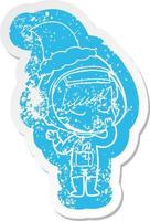 adesivo angustiado de desenho animado de uma linda garota astronauta usando chapéu de papai noel vetor