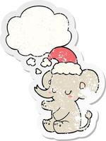 elefante de natal bonito e balão de pensamento como um adesivo desgastado vetor