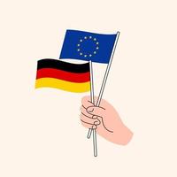 mão dos desenhos animados segurando a União Europeia e bandeiras alemãs. relações UE Alemanha. conceito de diplomacia, política e negociações democráticas. vetor isolado de design plano