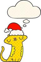 gato bonito dos desenhos animados usando chapéu de natal e balão de pensamento no estilo de quadrinhos vetor