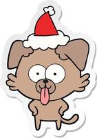 desenho de adesivo de um cachorro com a língua saindo usando chapéu de papai noel vetor