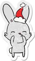 desenho de adesivo angustiado de coelho curioso de um chapéu de papai noel vetor