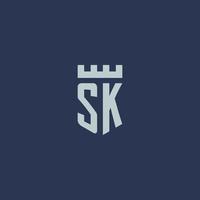 sk logotipo monograma com castelo fortaleza e design de estilo escudo vetor