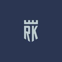 monograma do logotipo rk com castelo fortaleza e design de estilo escudo vetor