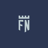 monograma de logotipo fn com castelo fortaleza e design de estilo escudo vetor