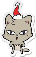 desenho de adesivo de um gato usando chapéu de papai noel vetor