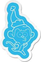 adesivo de desenho animado de um macaco surpreso usando chapéu de papai noel vetor