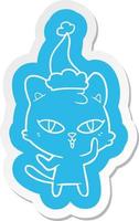 adesivo de desenho animado de um gato usando chapéu de papai noel vetor