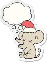 elefante de natal fofo e balão de pensamento como um adesivo impresso vetor