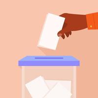 mão masculina, colocando o papel de voto nas urnas