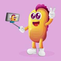 monstro amarelo fofo tira uma selfie com smartphone vetor