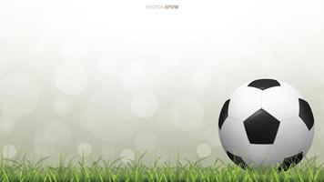 futebol ou futebol no campo de grama com bokeh verde vetor