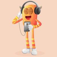 lindo monstro laranja ouvindo música em um smartphone usando um fone de ouvido vetor