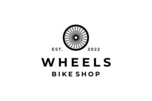 logotipo da loja de bicicletas de rodas pretas vetor