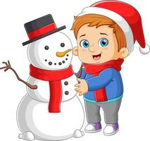 o menino está fazendo o grande boneco de neve e brincando com a bola de neve vetor