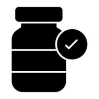 um ícone de design de glifo de frasco de comprimidos verificado vetor