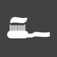 ícone invertido de glifo de escova de dentes vetor