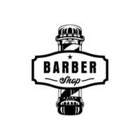 logotipo da barbearia com estilo clássico vintage. modelo de design de logotipo retrô de corte de cabelo vetor