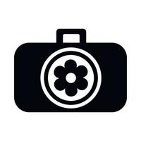 câmera fotográfica com flor no ícone da lente vetor