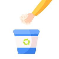 uma mão colocando um lixo de papel em uma lata de lixo de reciclagem azul. o conceito de uma triagem de resíduos