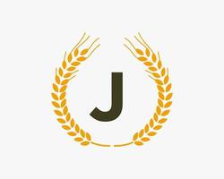 design de logotipo de agricultura de letra j com símbolo de trigo vetor