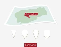 curvado papel mapa do Camboja com capital Phnom penh em cinzento fundo. quatro diferente mapa PIN definir. vetor