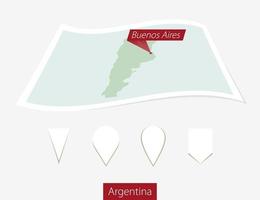 curvado papel mapa do Argentina com capital Buenos aires em cinzento fundo. quatro diferente mapa PIN definir. vetor