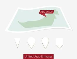 curvado papel mapa do Unidos árabe Emirados com capital abu dhabi em cinzento fundo. quatro diferente mapa PIN definir. vetor