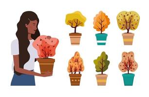 mulher afro com plantas de outono em vasos de cerâmica vetor