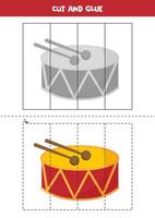 Corte e cole o jogo para crianças. tambor de desenho animado. vetor