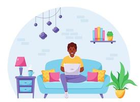 homem afro-americano sentado em um sofá e trabalhando no laptop. freelancer, conceito de escritório em casa. ilustração vetorial vetor