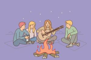 grupo amigos estão sentado por aí fogueira com guitarra desfrutando acampamento e tarde relaxamento em de praia debaixo estrelado céu. rapazes e meninas cantar para guitarra enquanto aquecimento si mesmos perto fogo em selvagem de praia vetor