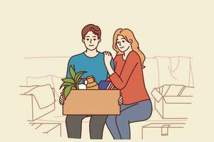 feliz casal é sentado em sofá com cartão caixa depois de comovente para dentro Novo casa ou comprando próprio apartamento. família do homem e mulher sorrir feliz sobre alugando propriedade dentro elite área e comovente vetor