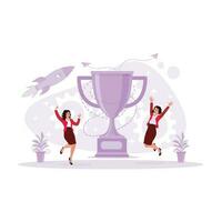 dois jovem mulheres, de pé, levantando seus braços e 1 perna com uma grande troféu dentro a meio, torcendo em a realização Como a vencedora do uma bem sucedido empresária. vetor