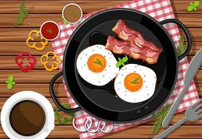 vista superior da refeição do café da manhã com ovos fritos e bacon em uma panela no fundo da mesa vetor
